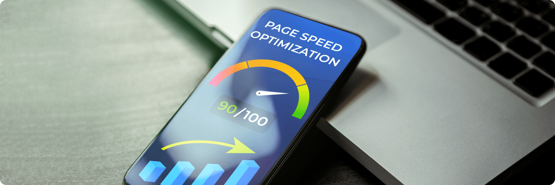 A smartphone showcasing a Page Speed Optimization screen, with a 90/100 gauge in green and orange hues, points upward. It rests on a laptop, highlighting digital performance—a testament to our SEO services as part of our digital marketing agencys expertise.
