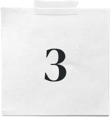 A white paper note with the number 3 in bold black font is secured to a surface with a strip of tape at the top, reminiscent of the precision and focus found in a top-tier digital marketing company.