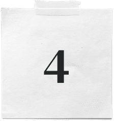 A white sticky note with the number 4 printed in bold black font is taped to a surface, resembling the meticulous planning board of a digital marketing company.