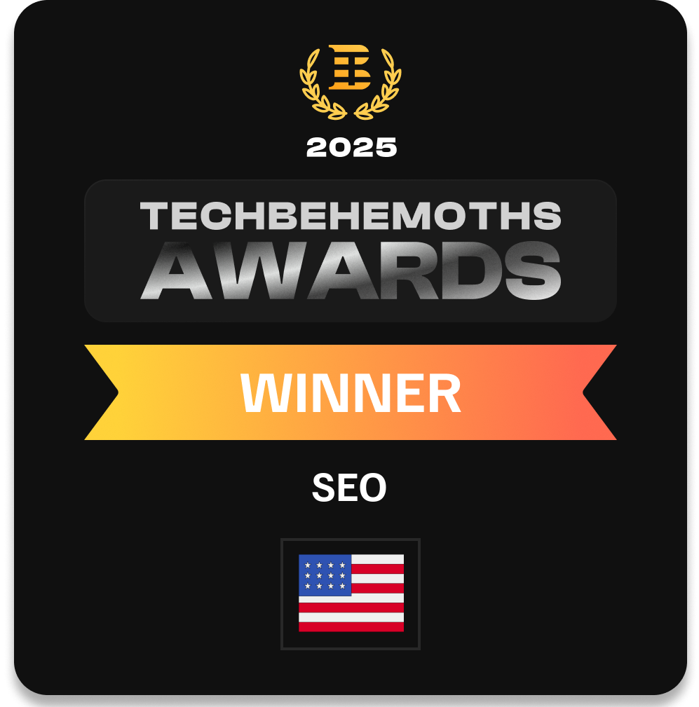 A black award plaque with TechBehemoths Awards 2025 WINNER SEO text, celebrating a leading digital marketing company, featuring a gold laurel logo at the top and a USA flag at the bottom.